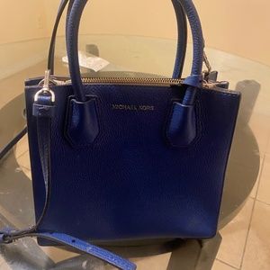 Michael Kors cross body dark blue bag.